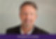 Smiling man in a suit against a neutral background. Text: "Appeal in Action" on a purple banner below. Mood is professional and friendly.