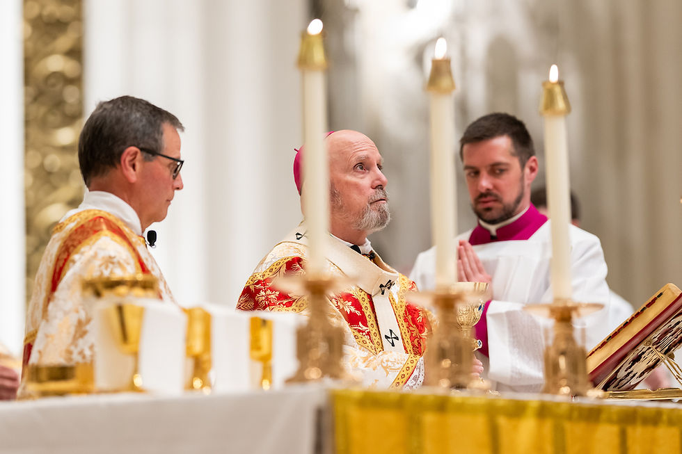 Three clergy in ornate robes during a religious ceremony. Candles are lit in a grand setting, with solemn expressions and focus.