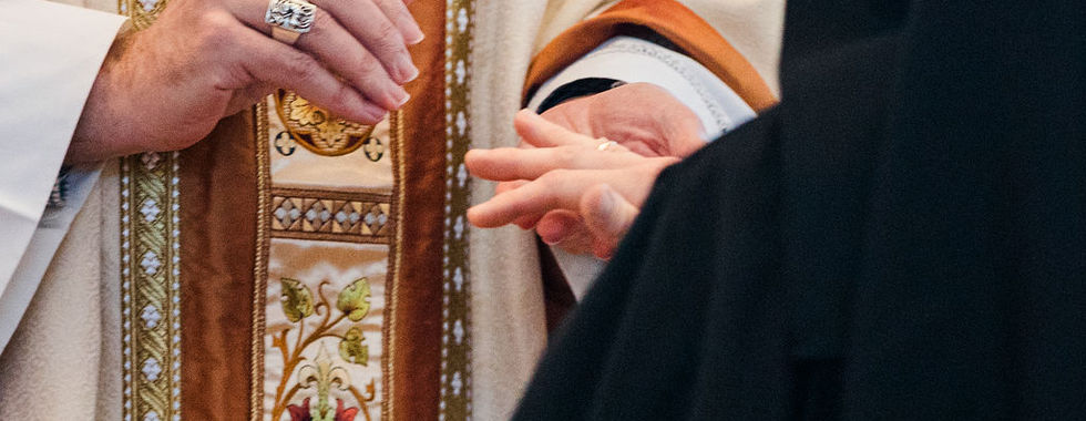 A close-up captures the exchange of rings during the profession ceremony, symbolizing commitment to Christ.