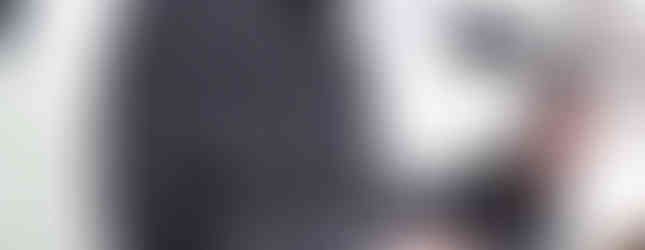 Side view of a speaker at a podium during the snowy Colorado March for Life.