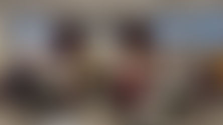 People sit at tables, listening to a nun speaking from a podium. A whiteboard reads "Welcome to the Gospel of Life Workshop."