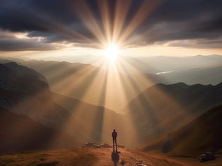 A person stands on a mountain peak at sunset, with sunbeams breaking through clouds. Majestic landscape, warm colors create a serene mood.
