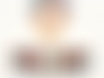 People in robes form a circle, gazing at a radiant dove in flames above. The scene is ethereal, with swirling warm colors.