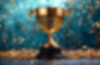 Golden trophy on a dark base surrounded by falling confetti. Background is a blurred teal with a festive, celebratory mood.
