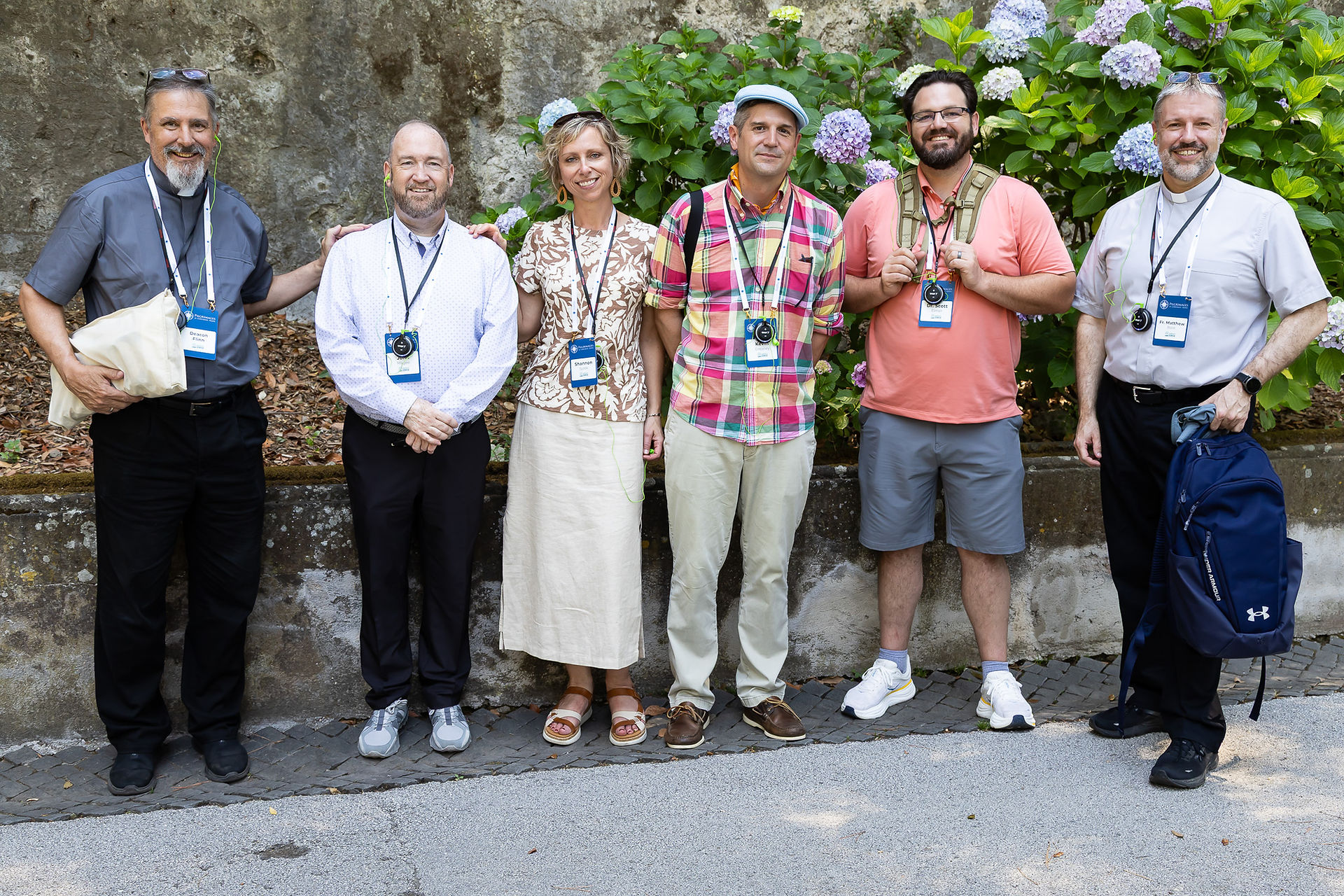 Members of the archdiocesan mission leadership team smile for a photo at the Borgo Laudato Si'.