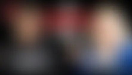 A seminarian in clerical attire and his mother, a blonde woman wearing a blue sweater, are superimposed on a black background. In a speech bubble between them, the words "YOU CONVERTED TOO?" are visible. "SON" and "MOM" are also visible underneath each of them.