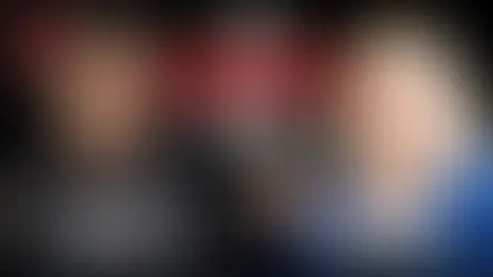 A seminarian in clerical attire and his mother, a blonde woman wearing a blue sweater, are superimposed on a black background. In a speech bubble between them, the words "YOU CONVERTED TOO?" are visible. "SON" and "MOM" are also visible underneath each of them.