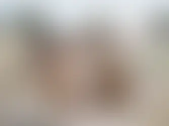 A group of people in historical attire walk through a desert landscape, with mountains in the background. The mood is calm and purposeful.