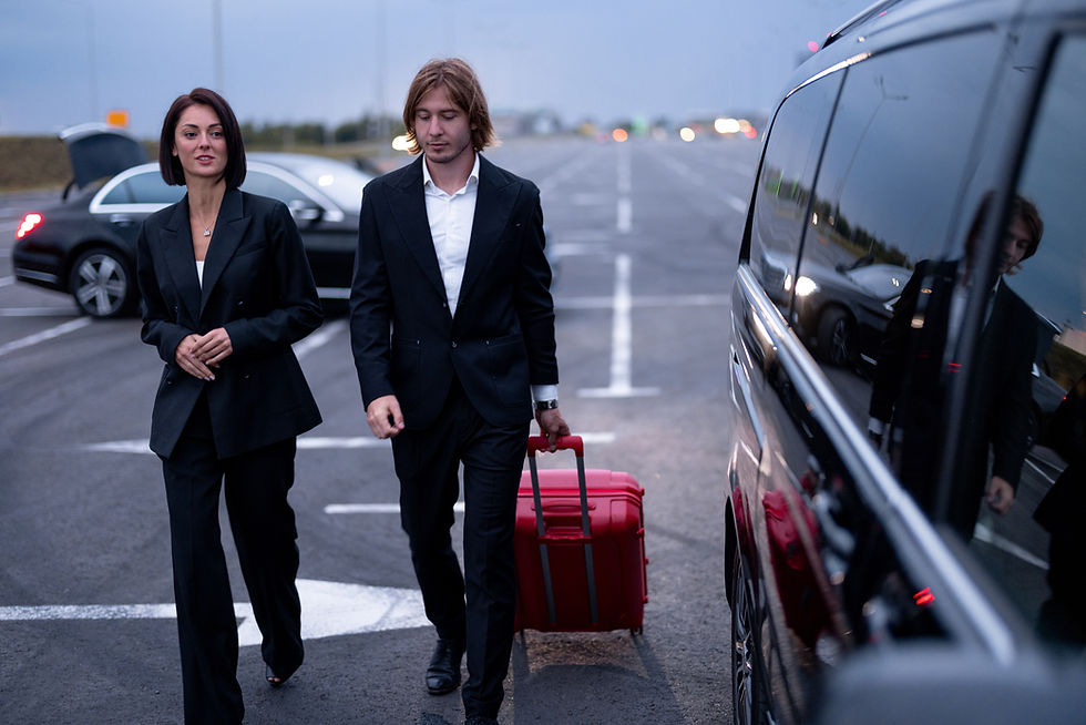 business-couple-walking-with-a-suitcase-on-parking-2025-03-13-23-03-13-utc.JPG