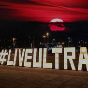 Large illuminated hashtag marquee letters at an outdoor Montreal event