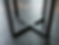 Thumbnail: Detail van het Cross onderstel onder een ronde eettafel in brons