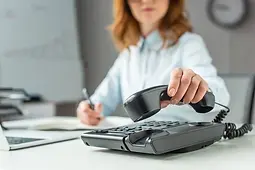 depositphotos_420575364-stock-photo-cropped-view-businesswoman-putting-handset.jpg