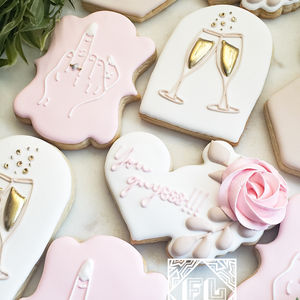 Custom decorated sugar cookies for bachelorette party with gold accents