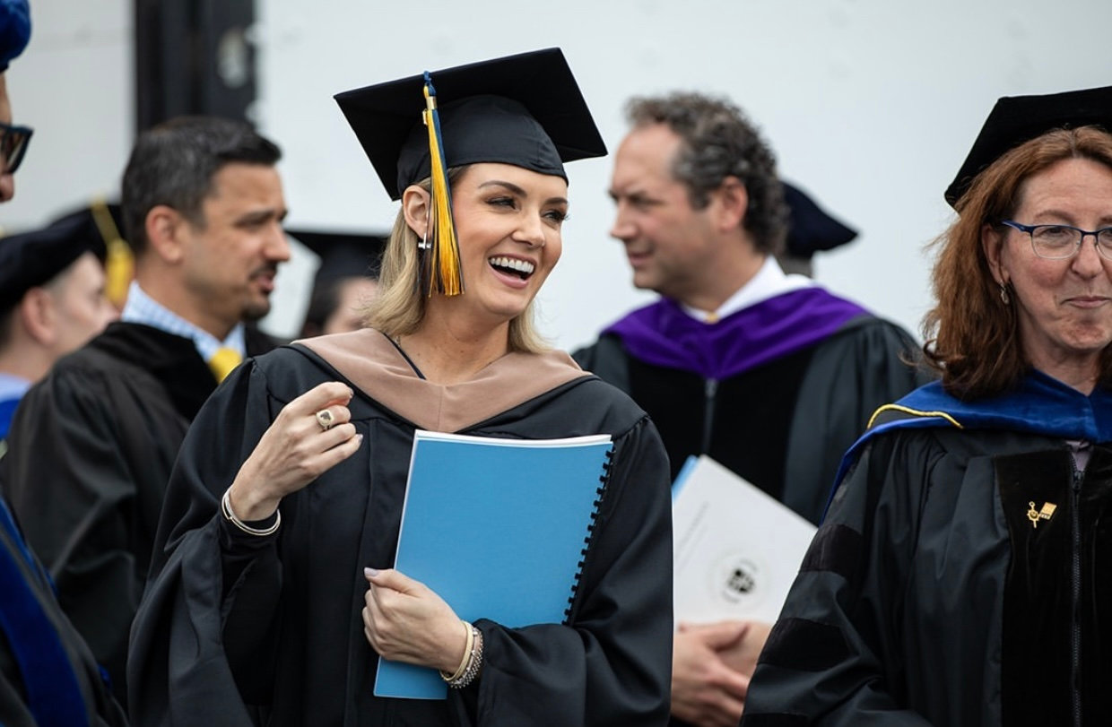 Jillian in cap and gown at graduation