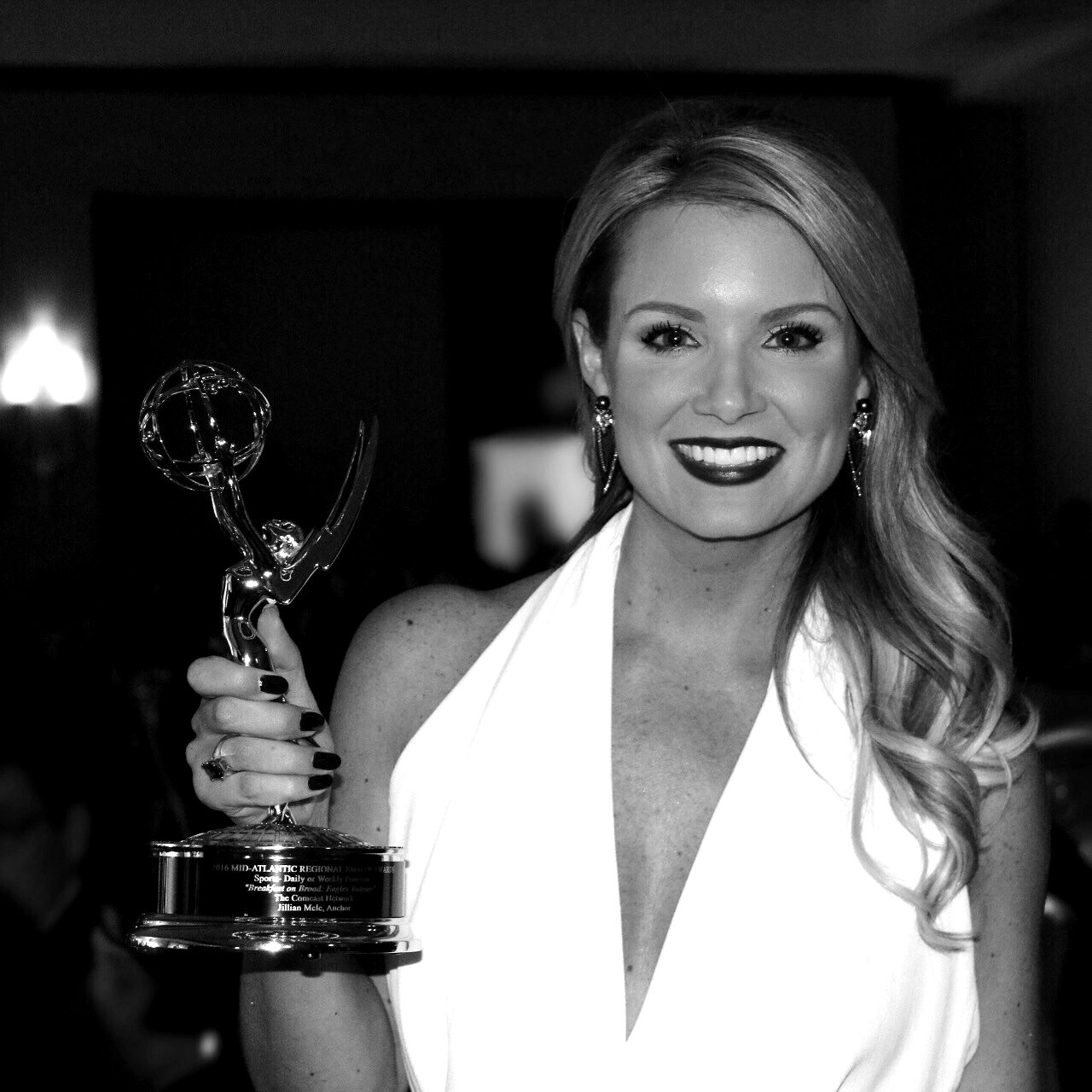 Jillian holding her Emmy Award