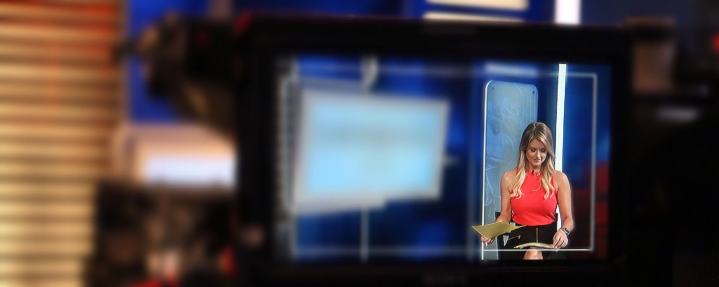 Jillian Mele anchoring a sports show in Philadelphia.
