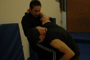 Knee strike to stomach whilst grappling
