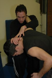 Knee strike to head from clinch