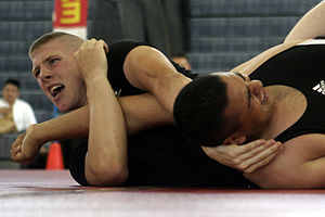 Mark Mullen applies an arm bar to Ernesto Mart...
