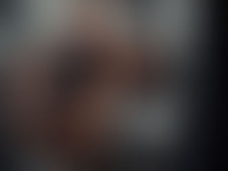 Senior man boxing in a gym, focused and muscular, amidst boxing equipment. Text: "Mastering the Check Hook in Senior Boxing Personal Training."