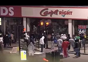 English: Looting carpet right shop in 2011 Eng...