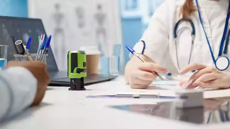 general-practitioner-putting-his-stamp-prescription-document_482257-116434.avif