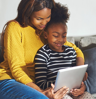 child and mom on tablet