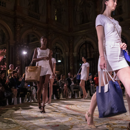 Models on catwalk walking on fashion event show