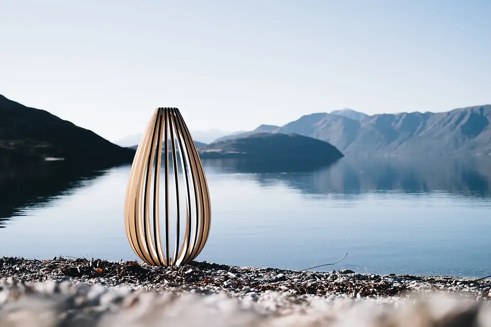 Floor lamp crafted from bamboo plywood with curved vertical uprights casting soft shadows.