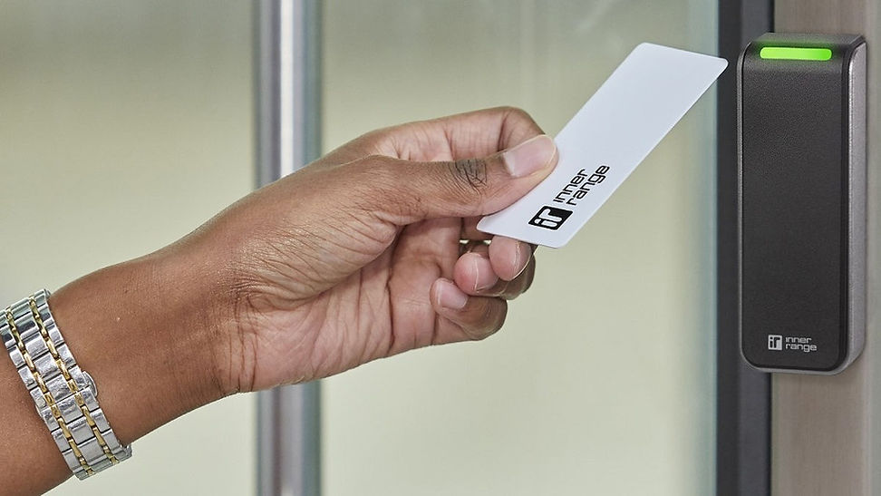 InnerRange photo of hand holding access card up to system