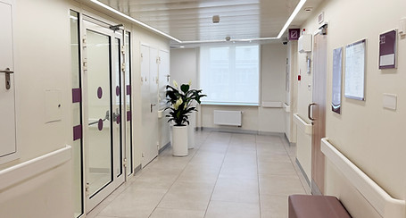 hospital hallway with doors and large seating area