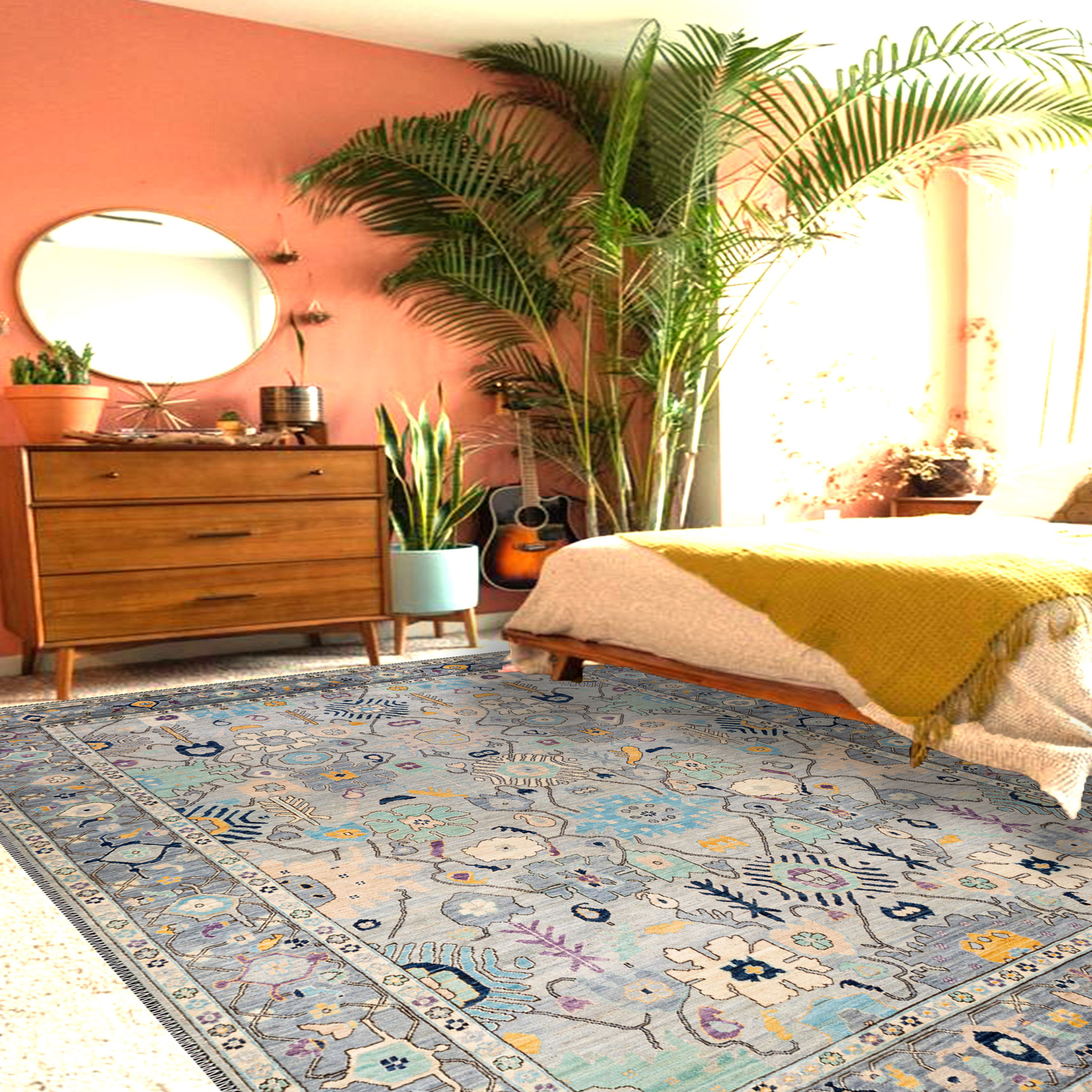 azurion blue tone rug close up showing animal motif and antique pattern texture