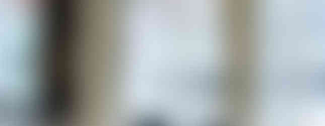 Beautifully decorated chuppah with baby's breath and greenery