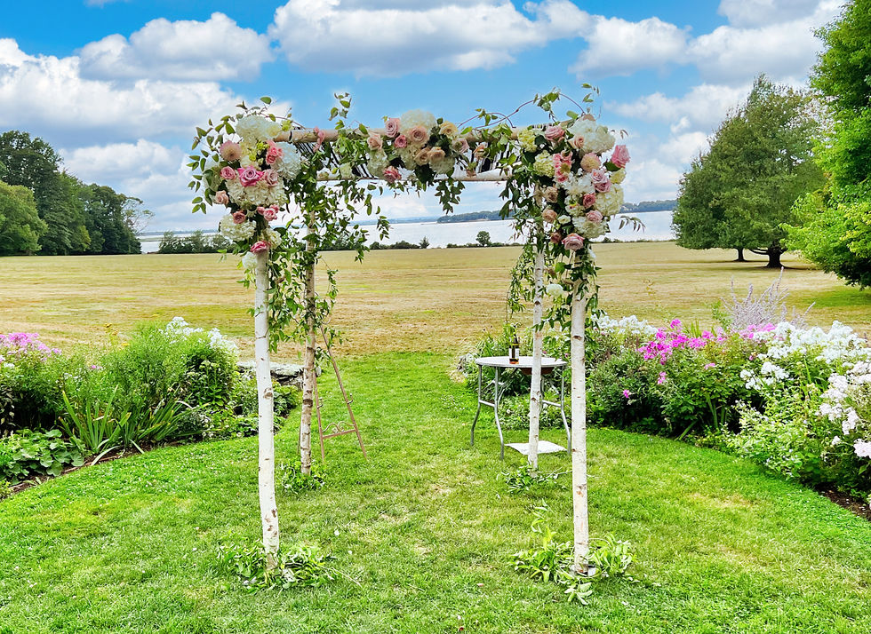 Custom bark chuppah rental with floral arrangements for outdoor wedding in Boston, Massachusetts
