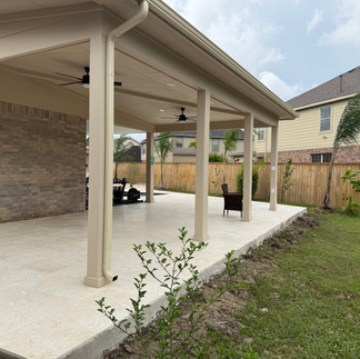 Covered patio with concrete deck finished in pavers