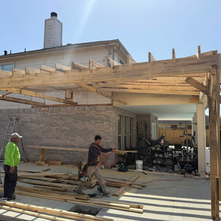 Covered patio with concrete deck finished in pavers