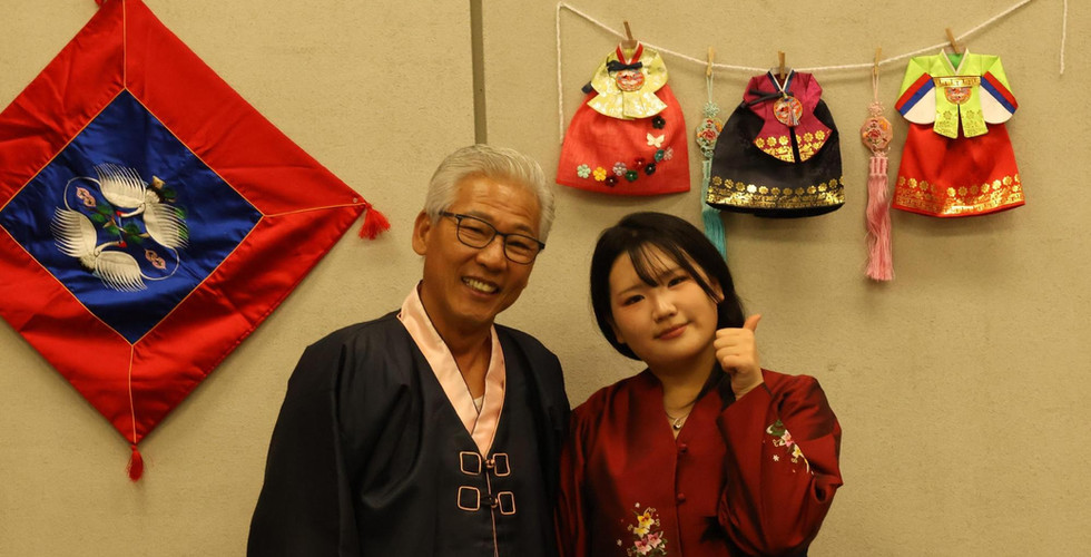 Doug Park pictured with his daughter dressed in a traditional Hanbok.
