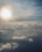 Cloudy skies with the rising sun hidden