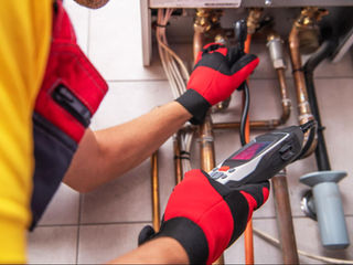 HVAC technician inspecting a residential heating system for repair needs