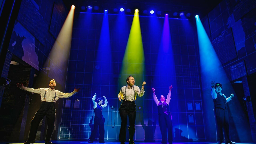 The cast of Operation Mincemeat spotlighted in multicolour