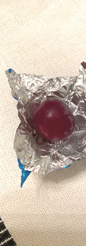 Grape in empty foil wrapper