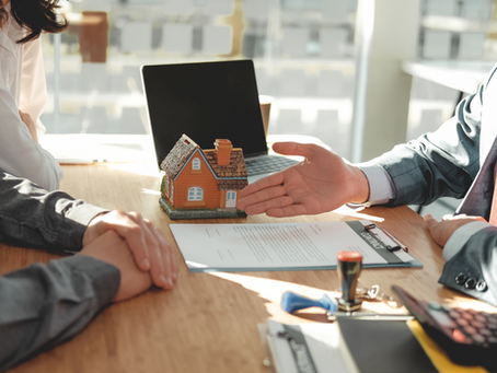 hand of person showing property title contract for property conveyancing