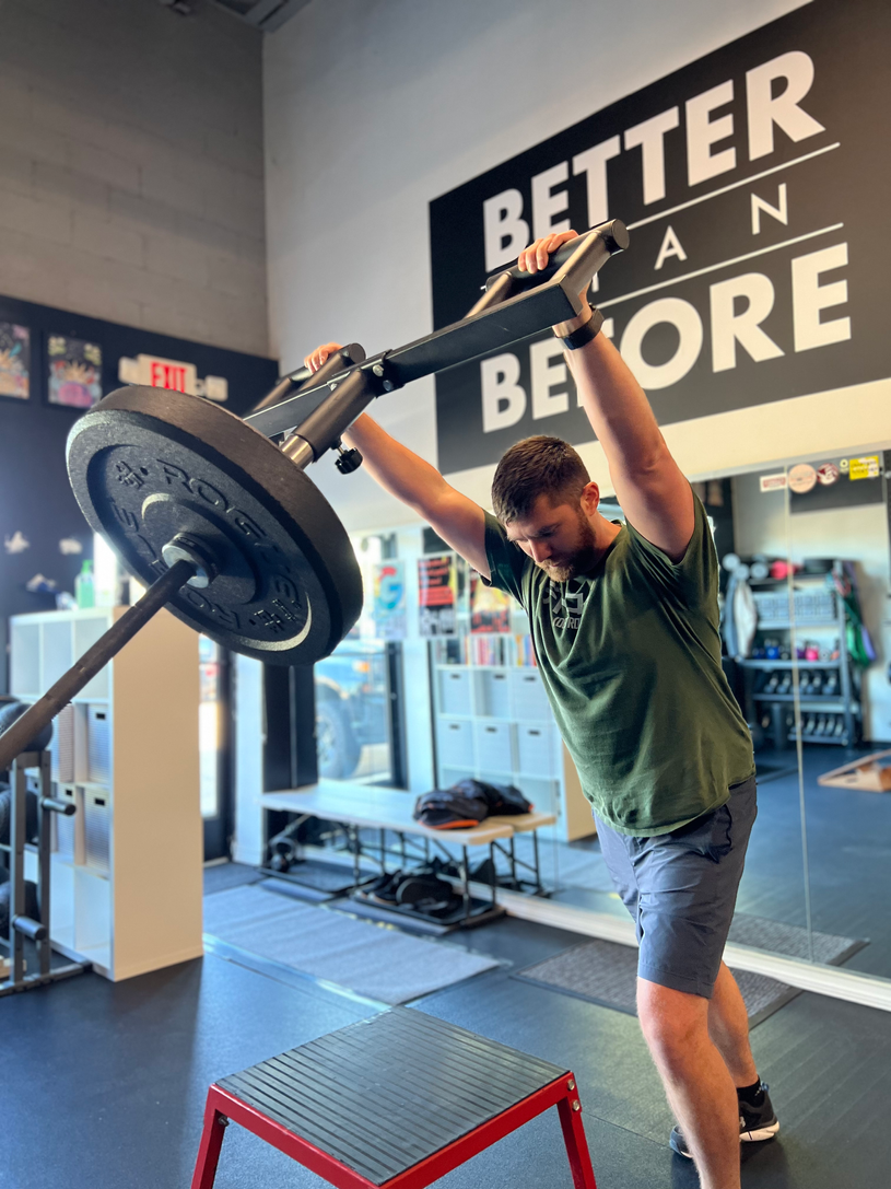 A man working out at Brain Meets Brawn in Ferndale Michigan, a private personal training studio.
