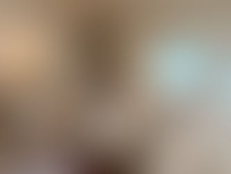 Bright and airy living room with fireplace.