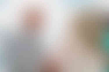 Smiling groom saying his vows