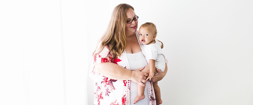 A mother and doula cradling her baby