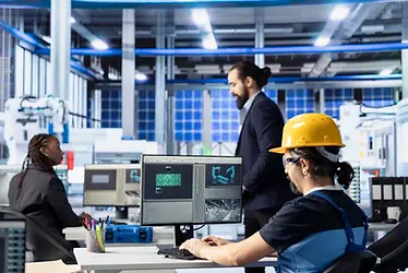 photovoltaics-factory-employee-diagnosing-gear-performance-issues-using-pc.webp