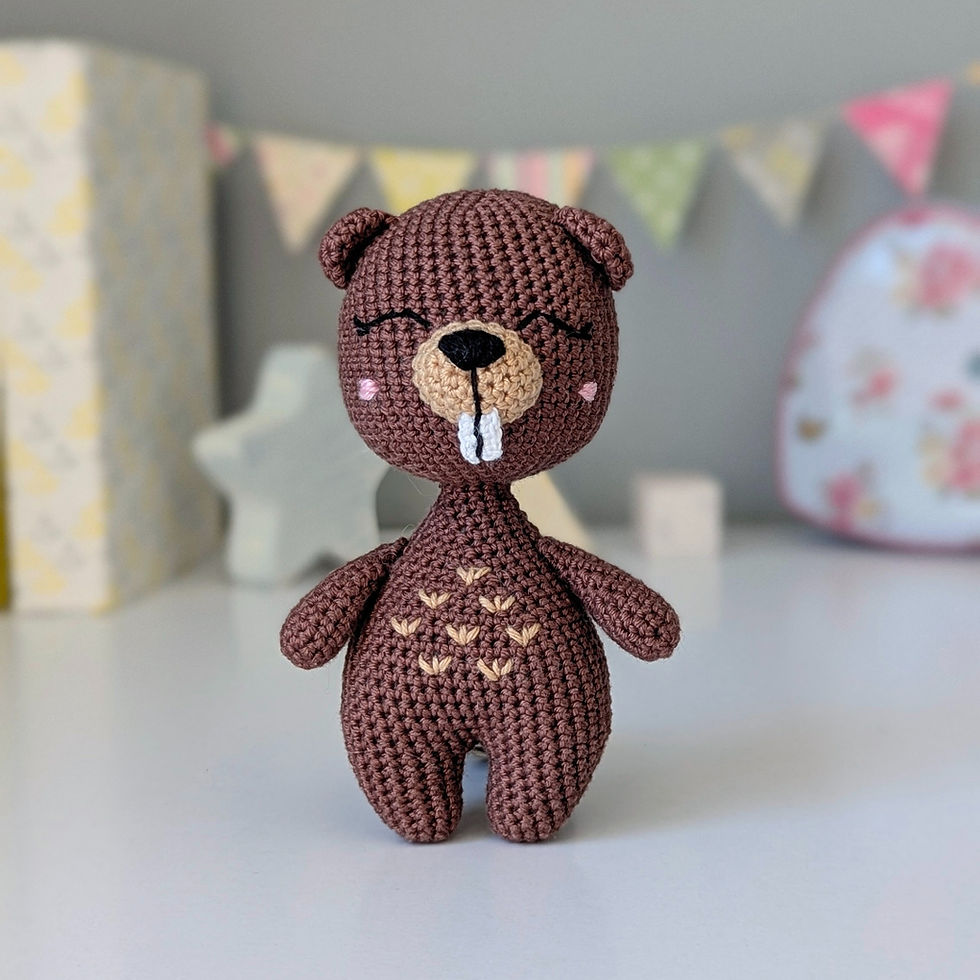 Crocheted stuffed animal Beaver in brown color with embroidered eyes and cheeks