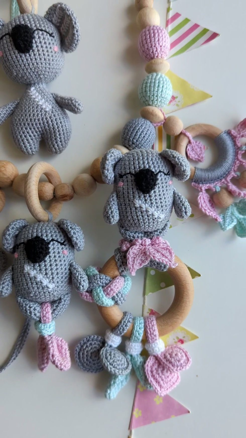 Video gift set for a baby of 5 handmade toys and accessories in pastel colors from the Cozy Koala collection by ColoredYarn