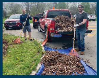 ConnectLife staff cleaning up leaves